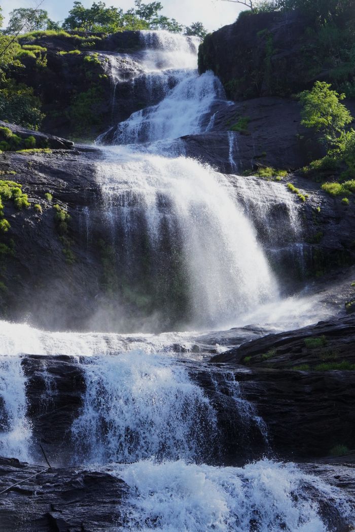 Beautiful waterfall cascading in lush greenery at Alappuzha, Kerala, India.